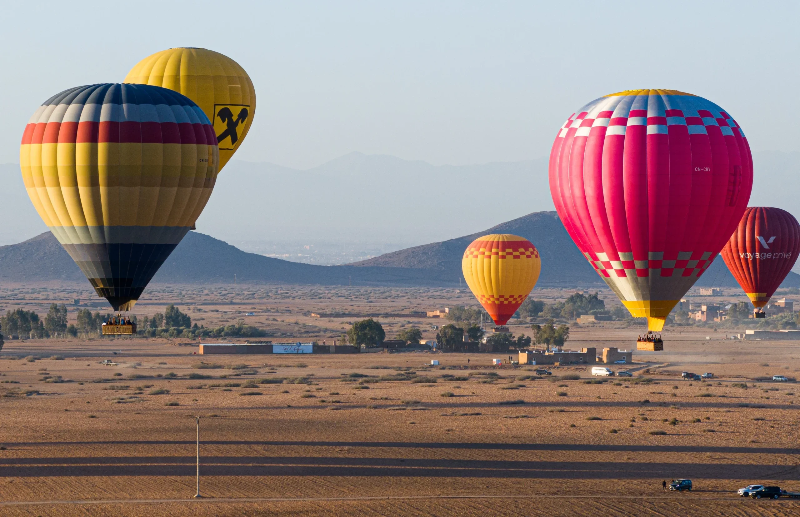 Hot air balloon floating over the Souss plain and Atlas mountain foothills near Agadir at sunrise